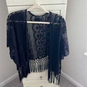 Black lace cover with fringe. One size